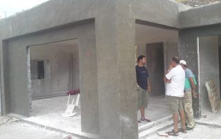 technicians talking inside a construction building